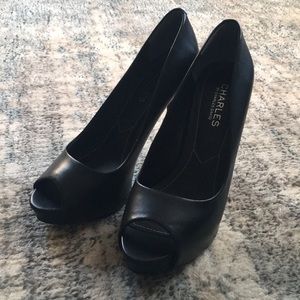 Black peep toe leather pumps